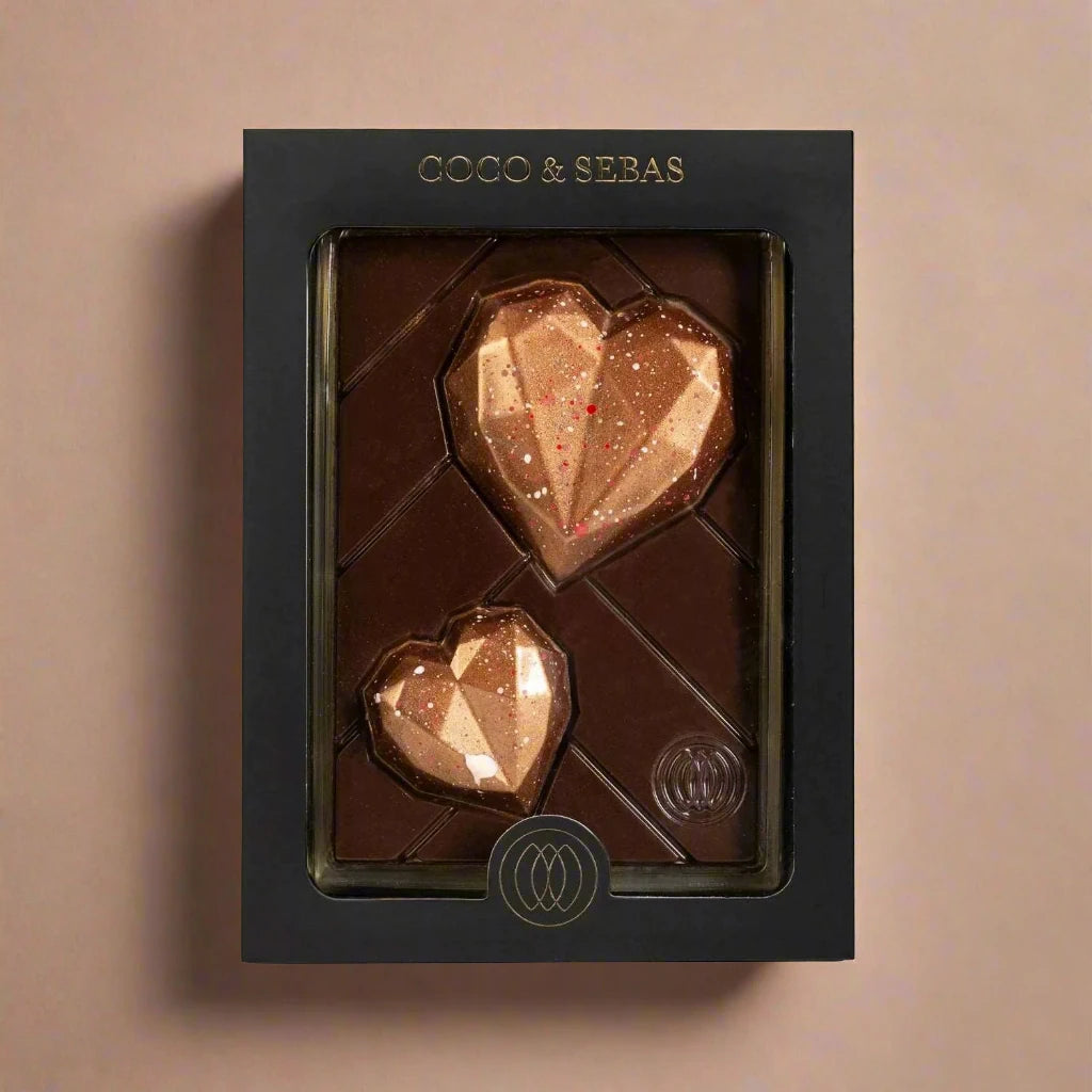 Bronze hearts on a slice of dark chocolate